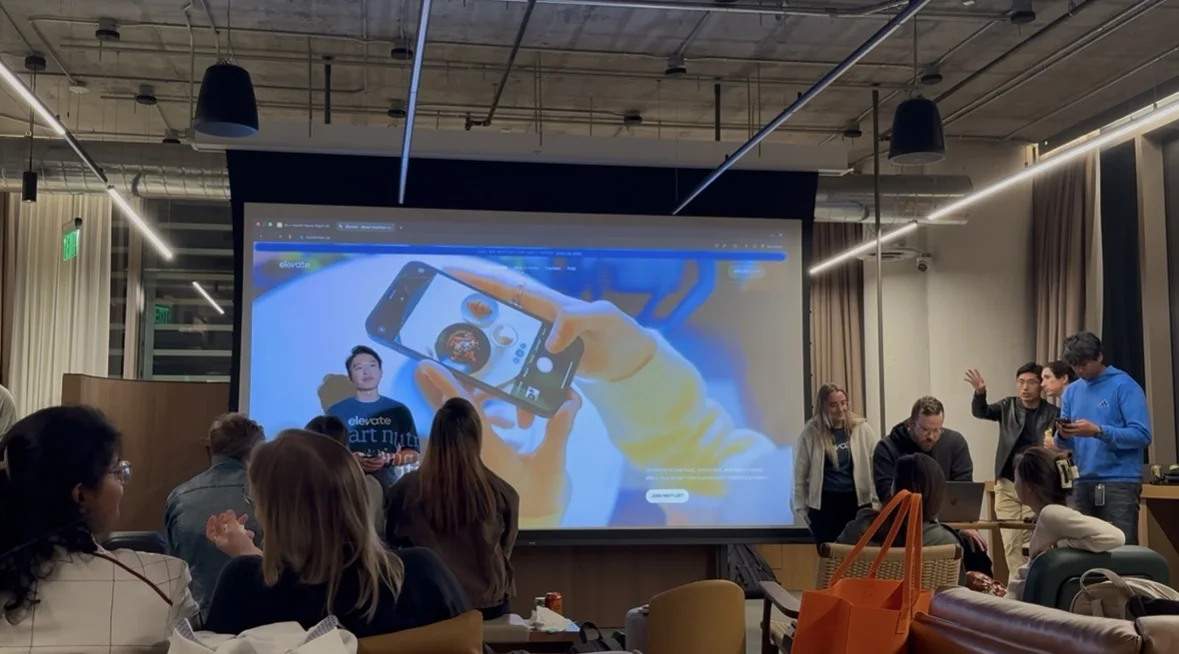 Presenting the Elevate website on a big screen to a seated audience