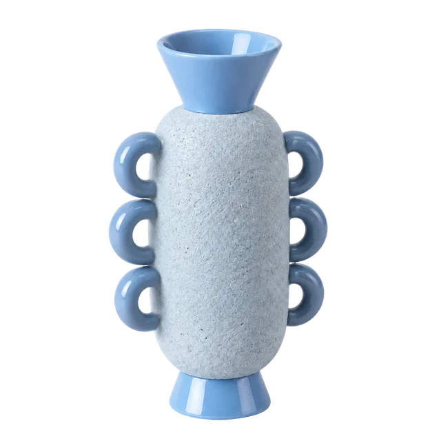 A blue vase with ring handles